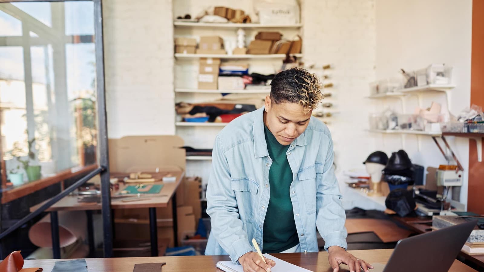 Small business owner in a workshop comparing quotes from the best SEO companies for small business