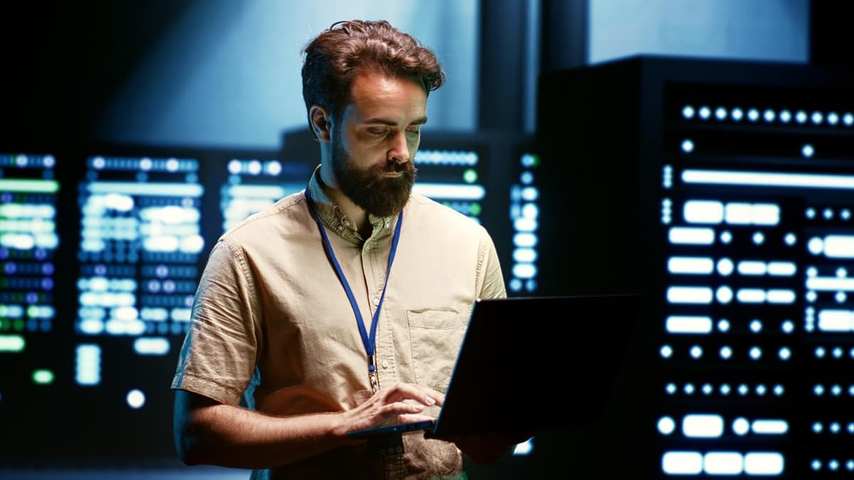 Technician checking network equipment, where firewall rules decide which AI crawlers get through